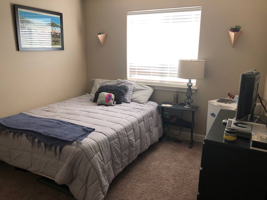 Guest bedroom with TV. We have a selection of DVD’s to choose from.