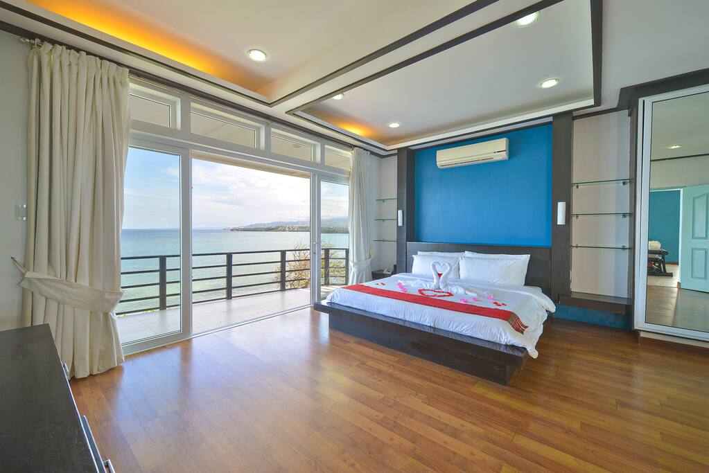 Oceanview master bedroom with terrace patio