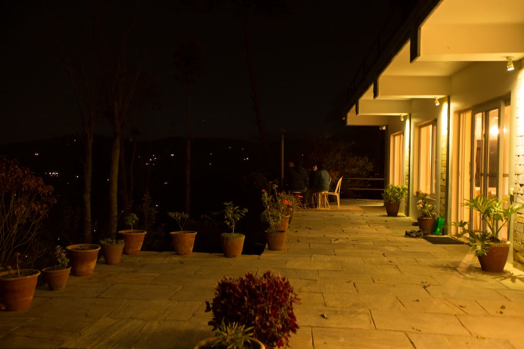 Sit next to a warm fire and enjoy the starry night sky. The surrounding hills are dotted by tiny lights, which makes you feel as if stars have completely covered you.