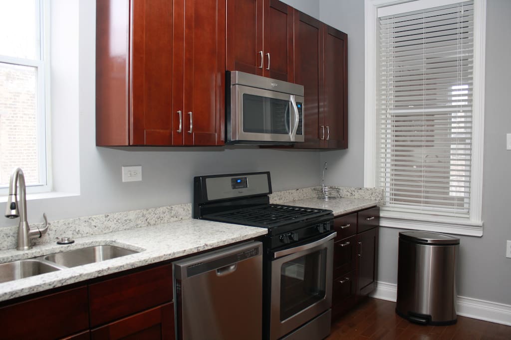 Kitchen with SS appliances, dishwasher, garbage disposal.