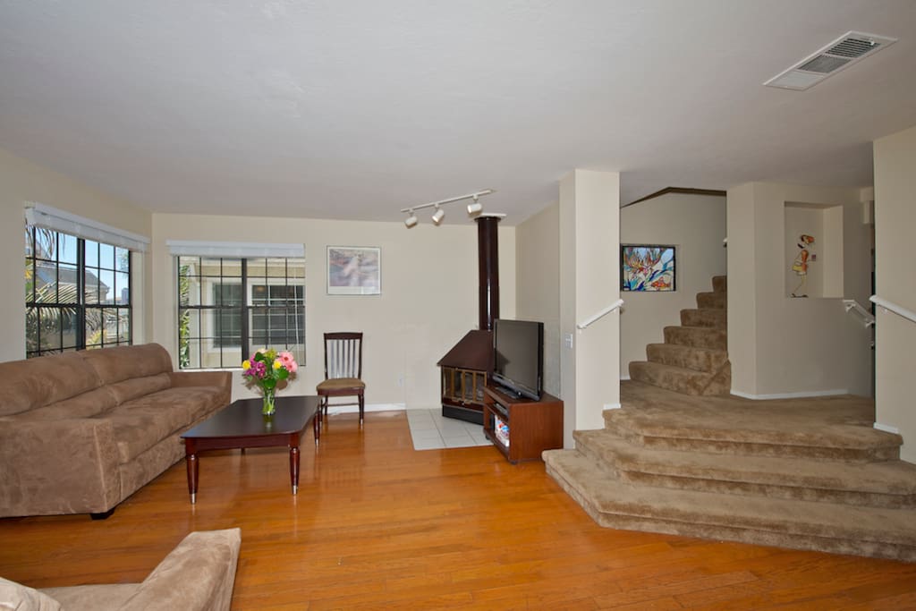 Living room with flat screen TV and DVD player, co