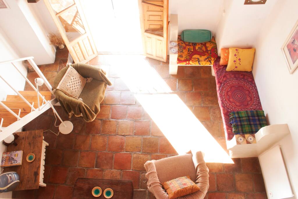 Sunny sitting room with music player and log burner for cosy winter evenings