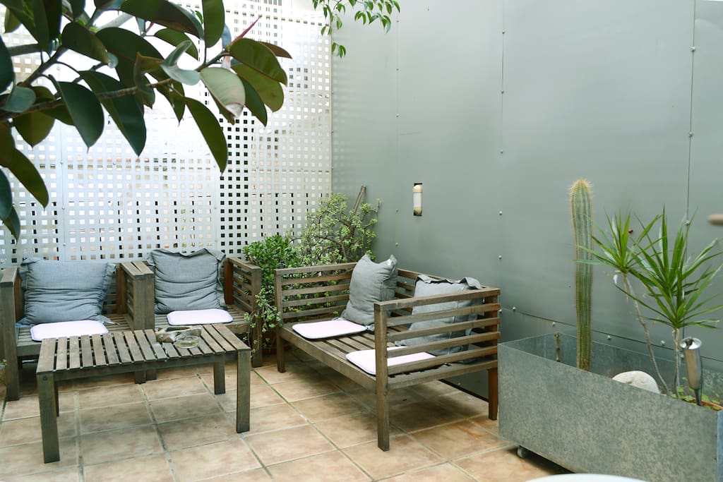 The rear terrace garden has two different areas: one for just chilling out, another for meals.