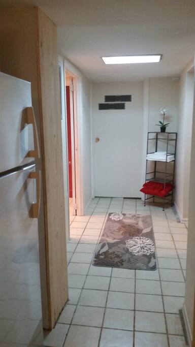 Hallway to bathroom and emergency exit door.