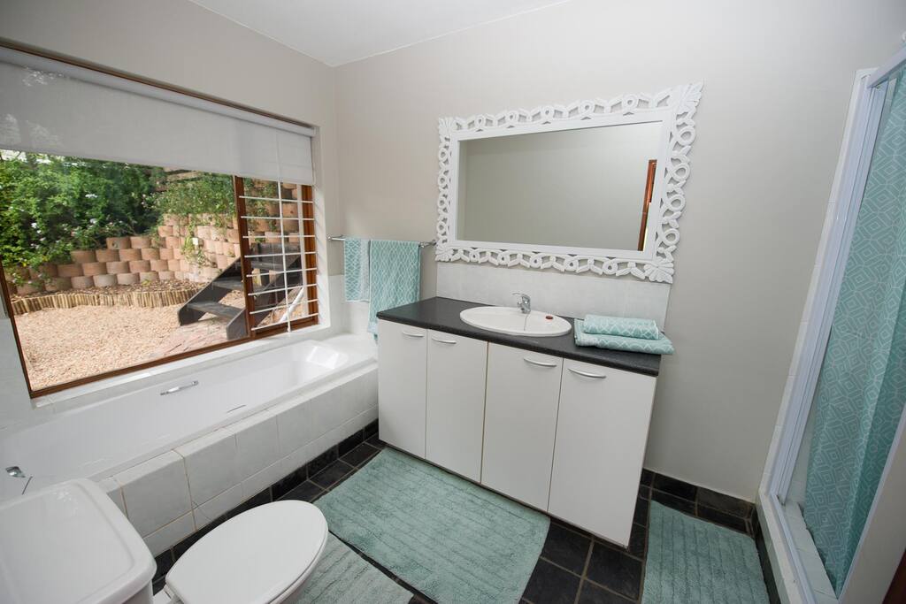 bathroom with separate bath and shower