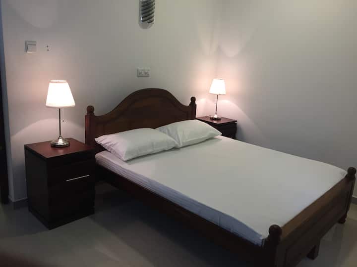 Spacious bedroom with easy access to shared villa facilities.
