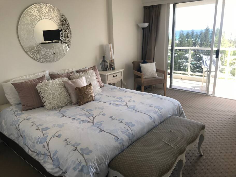 Main Bedroom onto balcony looking over Pacific Ocean
