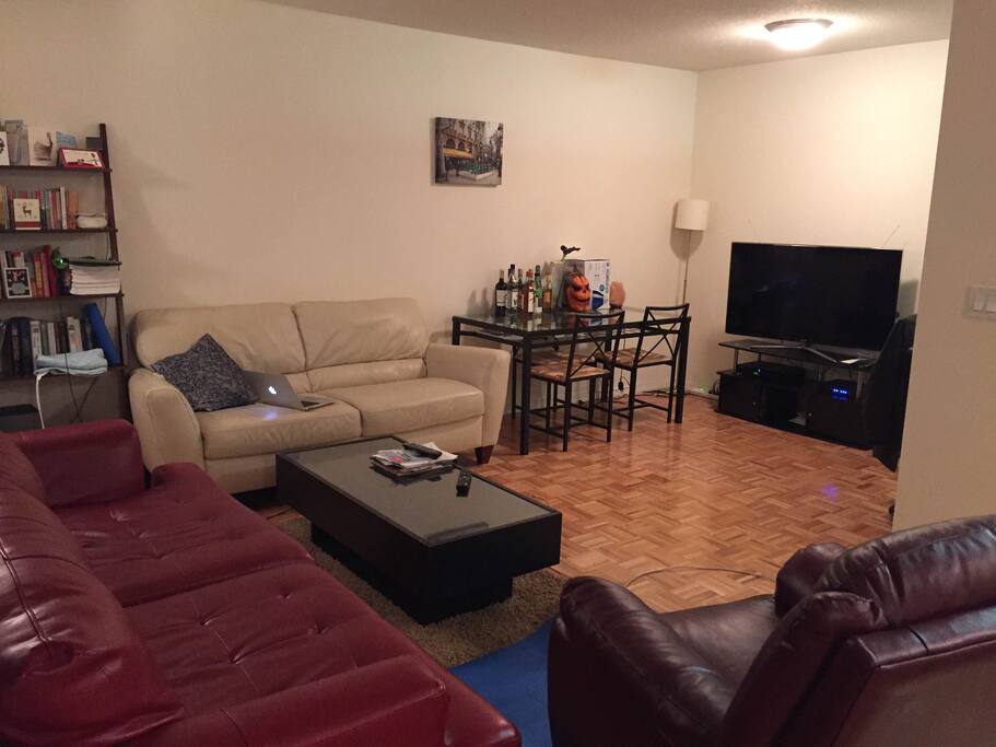 full view of the living room. kitchen on the right.
