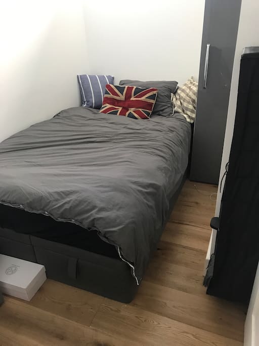 Guest bedroom, queen size bed with 2 wardrobes, 1 open window & 2 blinds