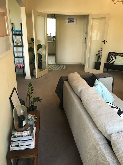 Opposite view of lounge room, looking into hallway and kitchen.
Large dining room / workspace to the left.