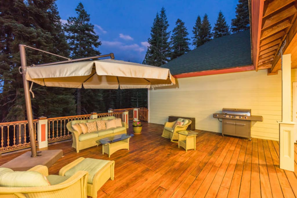 The back deck has a gas grill and seating for five.