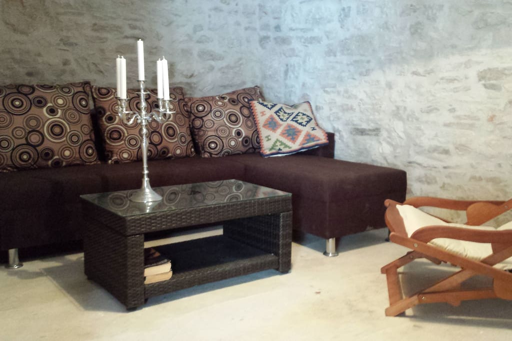 Our living room / TV room. We have made visible the beautiful old stonewalls.