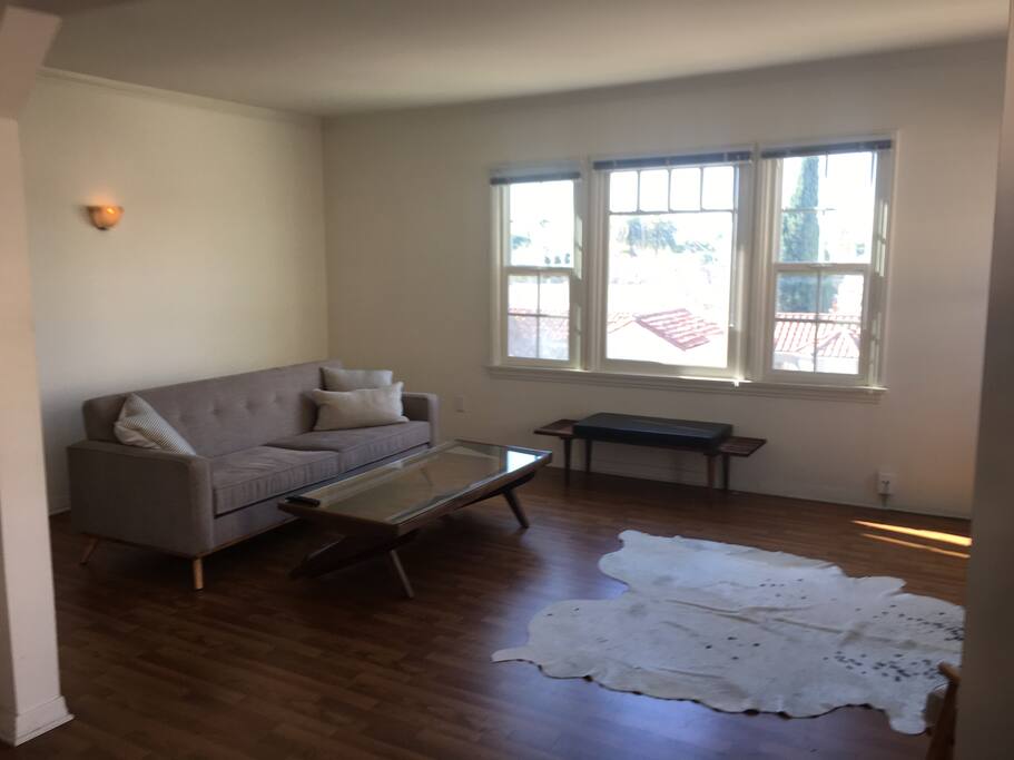 LIVING ROOM view through windows of Los Angeles skyline