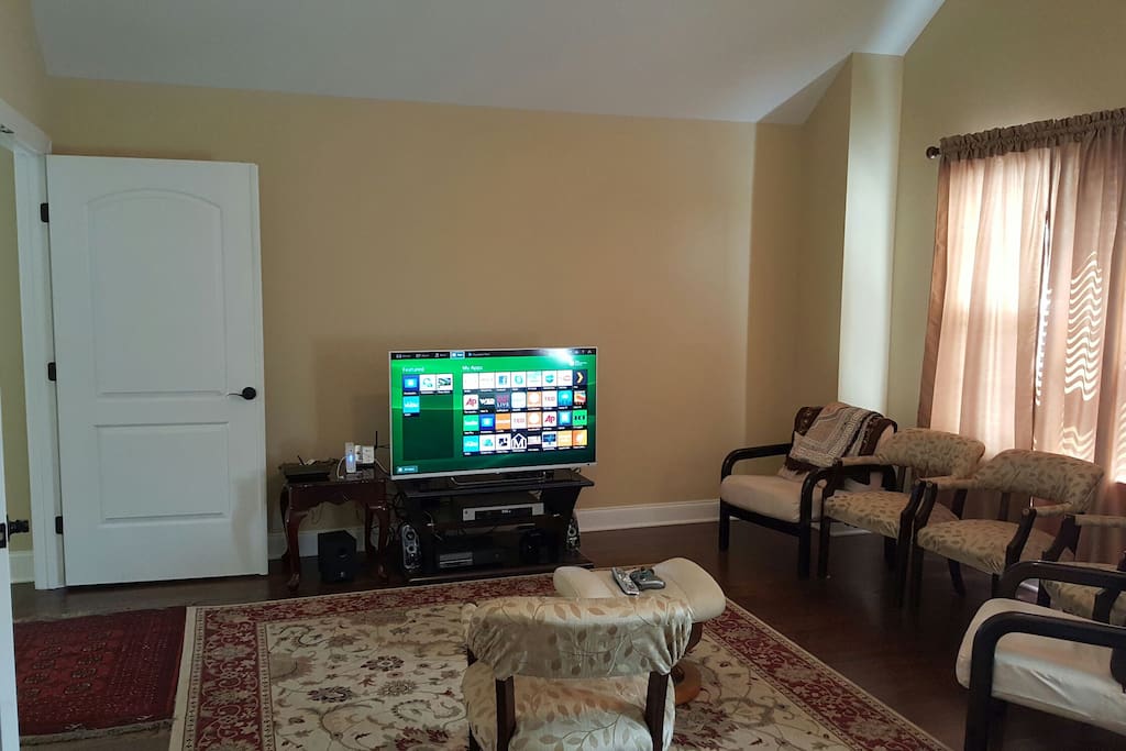 Entertainment room with wrap around sofa, seats, and full bath (behind me) Happy entertaining!