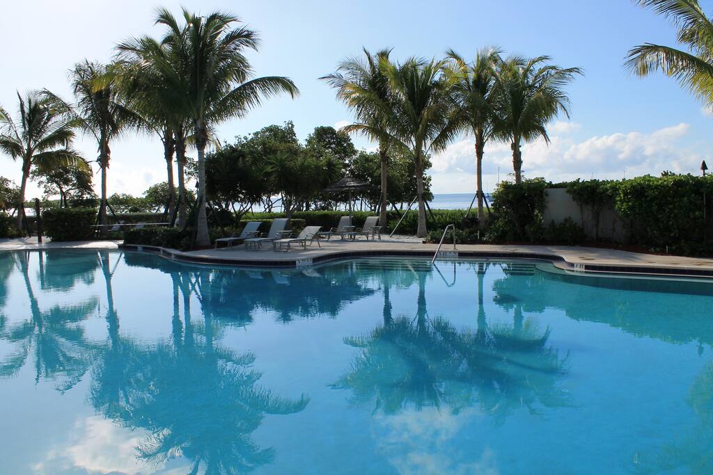 Relax in beach chairs around one if two large ocean front pool or in the private sun-tanning beavh
