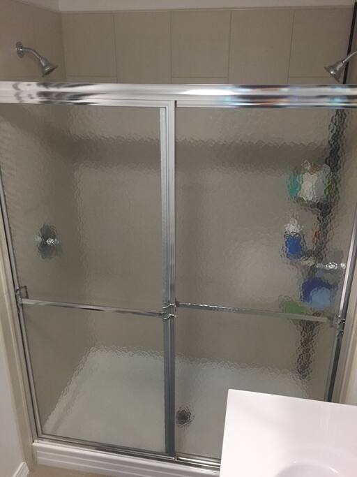 Dual shower heads!! They will rock your world. Downstairs master bathroom.