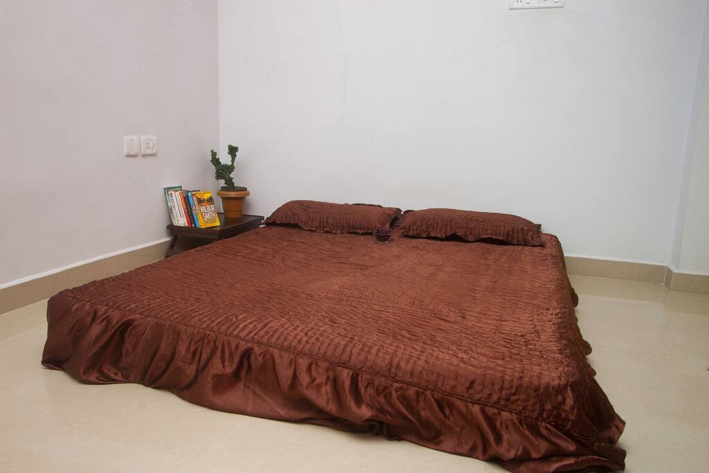 Comfortable bed with comforter and couple of our books to help you sleep peacefully...