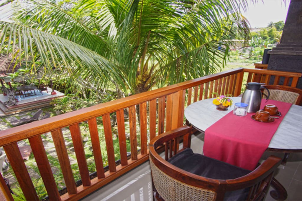 Balcony over the green garden and swimming pool