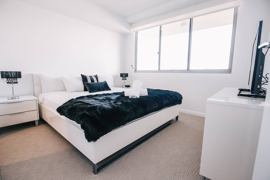 Master bedroom with a king bed