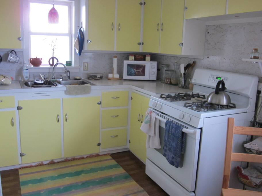 a cozy kitchen with lovely gas stove.