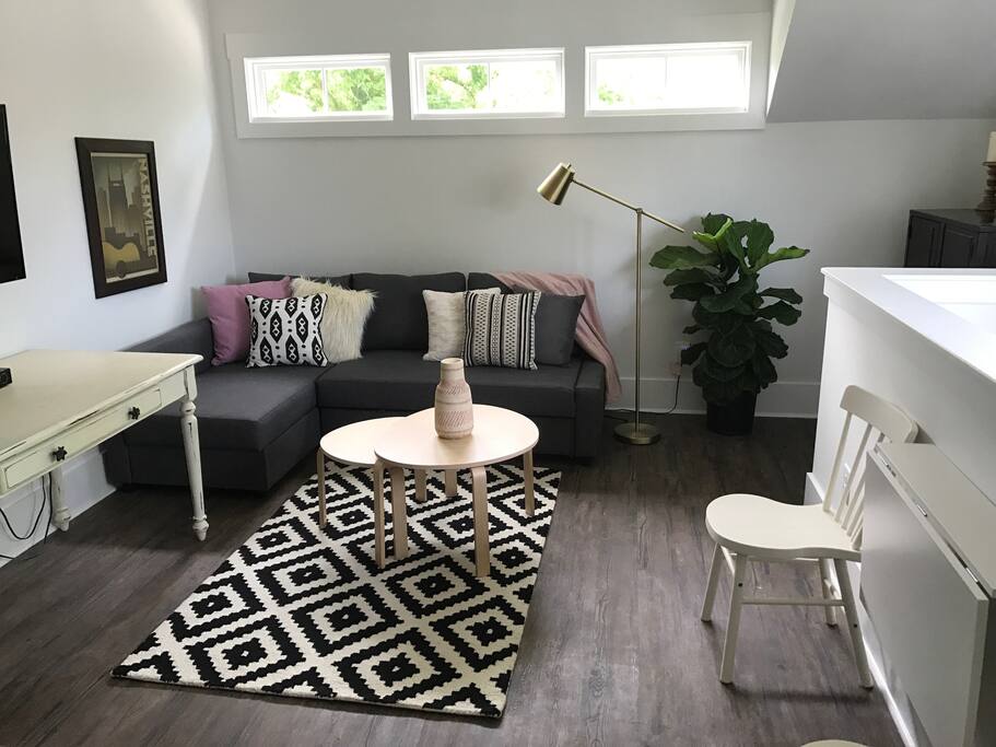 This cozy living room is perfect place to relax after a day exploring Nashville .