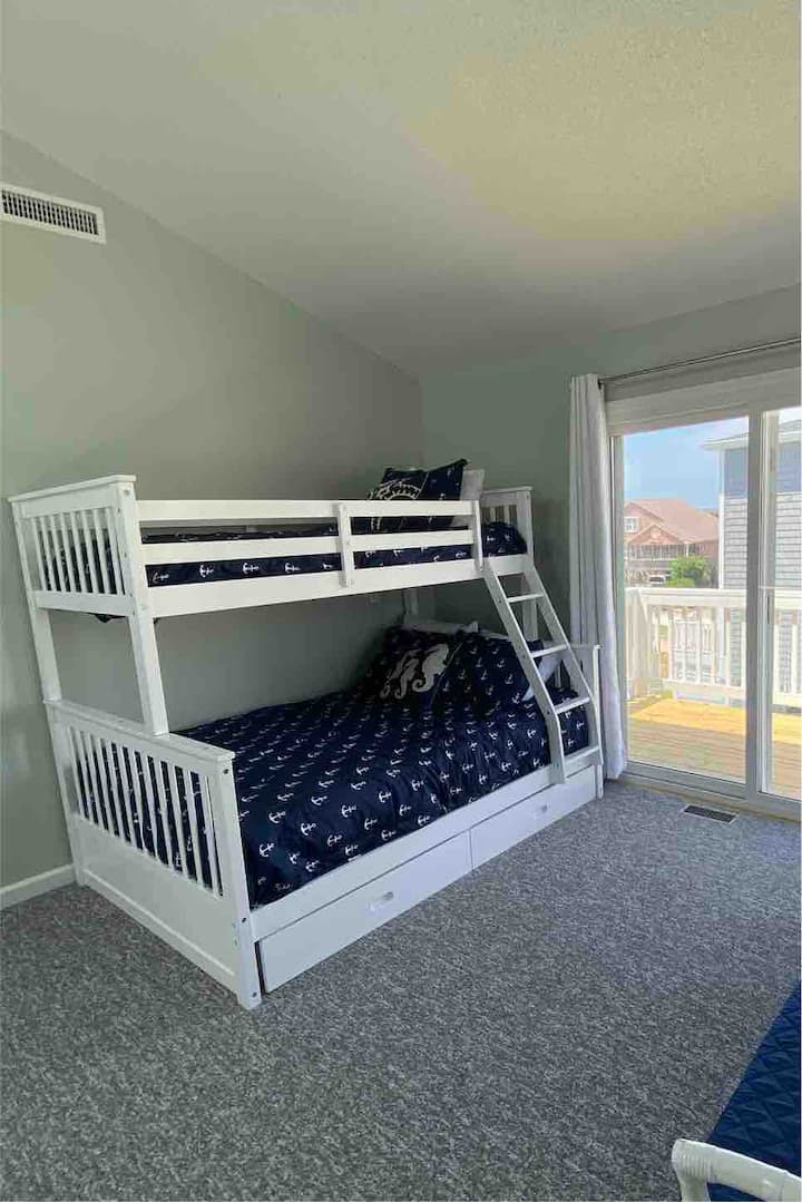 A favorite for kids, the loft can sleep 3 with a full + twin bunk bed. This room features a balcony off the back deck. 