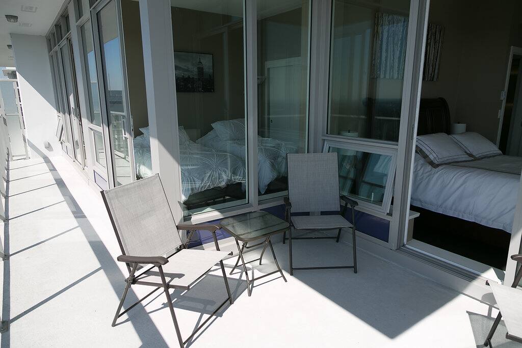 View from balcony into 2nd and 3rd bedrooms, access to balcony from each bedroom.