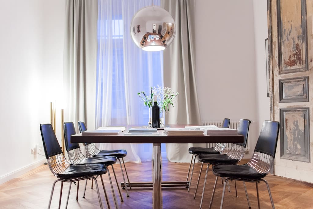 Dining/ Working area:
Designer mirror ball lamp by Fontana Arte, 70's designer chairs.