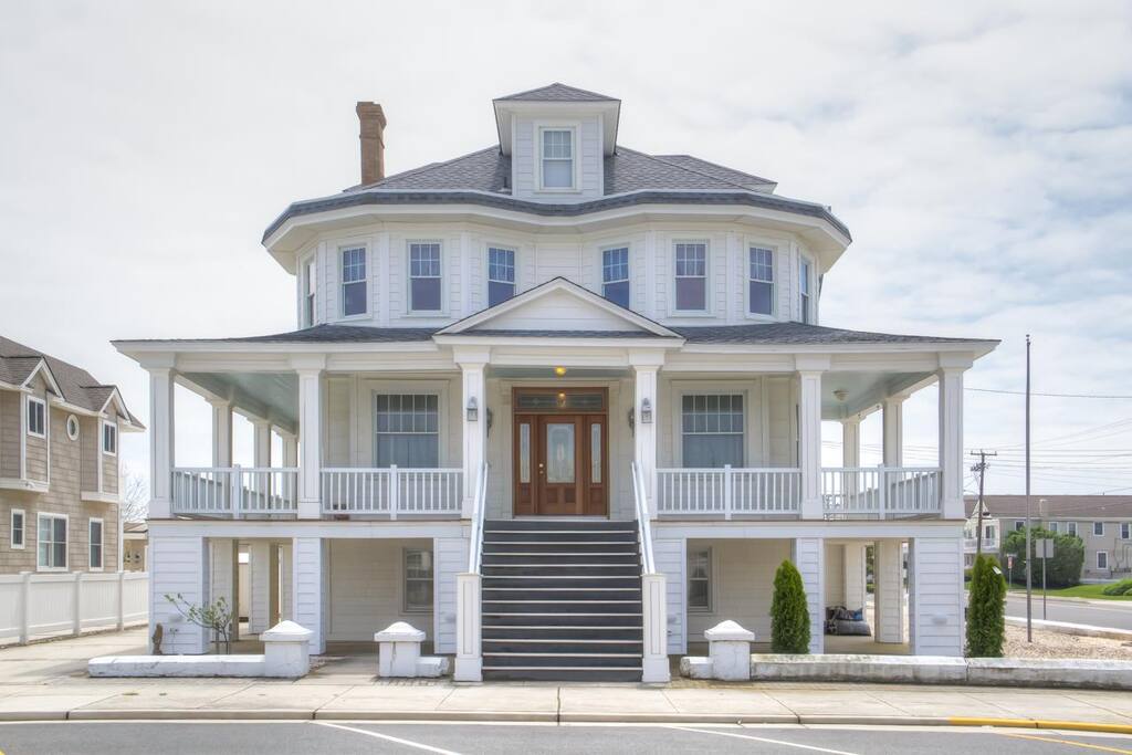 entrance in apartment under the front porch, driveway parking for 2 cars.