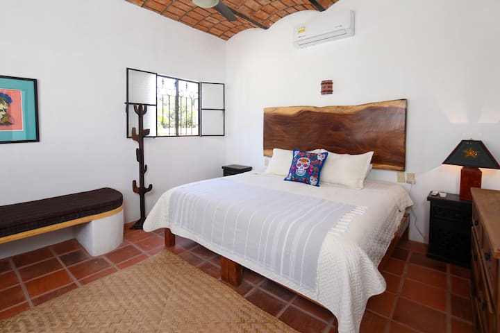 Air conditioned king bedroom in Penthouse - bench can be used as a small bed as needed.