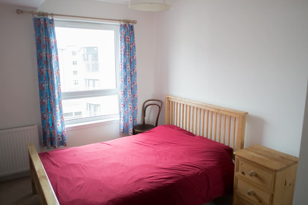 Light and comfortable bedroom in modern Edinburgh flat
