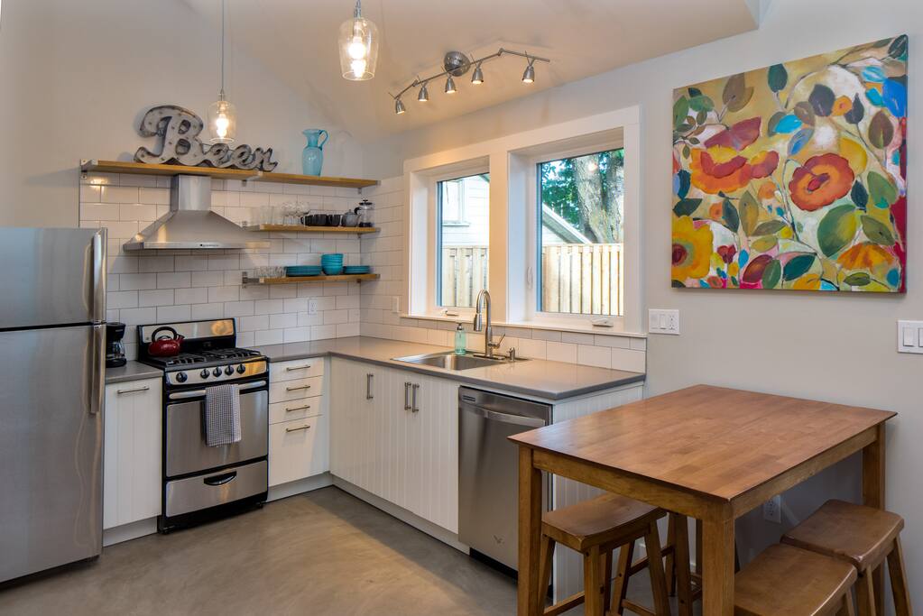 Dine at the bistro table with stools for four guests