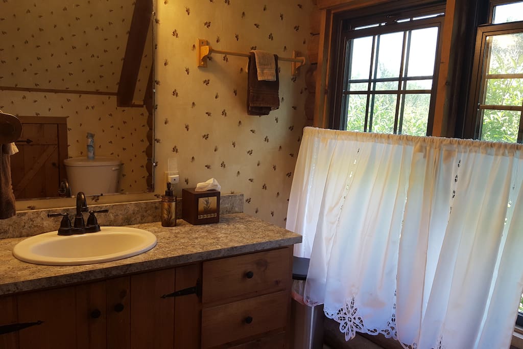 Large bathroom with shower. Towels, shampoo, conditioner, body wash and hairdryer provided.