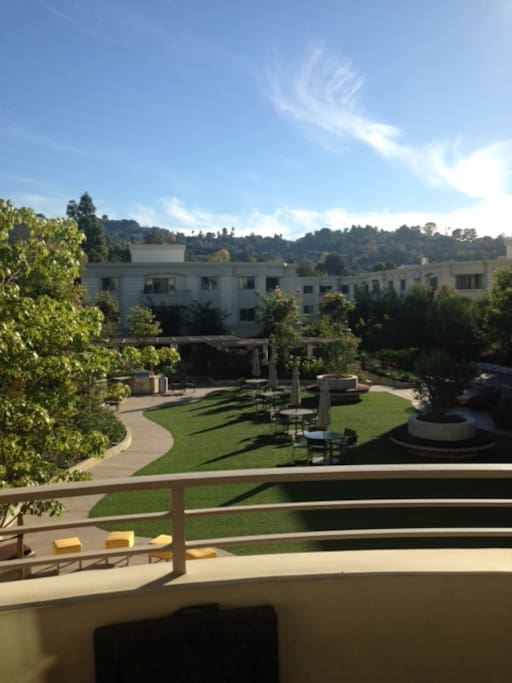 Balcony with gorgeous view overlooking courtyard. Same view from bedroom.
