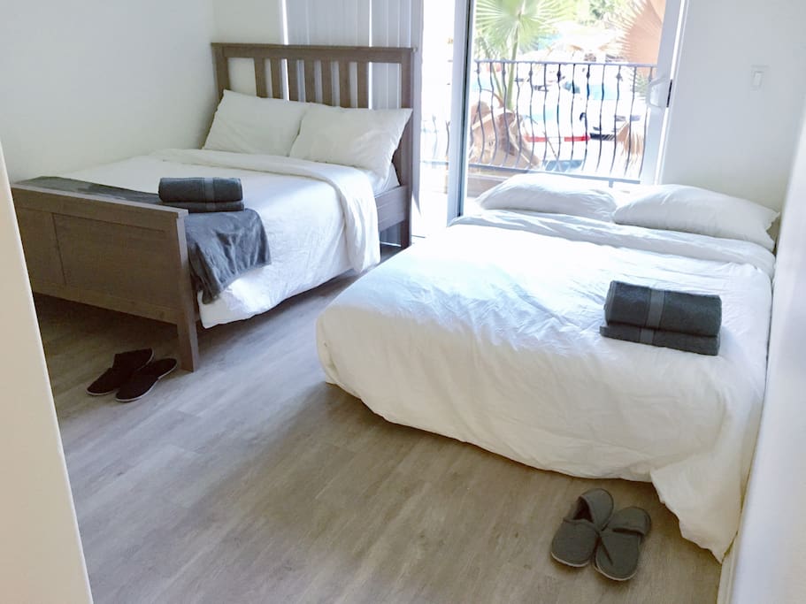 Two queen size bed and private balcony .