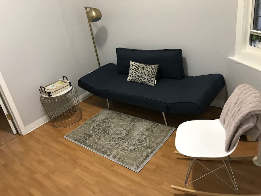 Living area with railroad style set up leading to master bedroom. The couch is a futon bed and there is also a blow up mattress for additional guests (twin size and very comfy)