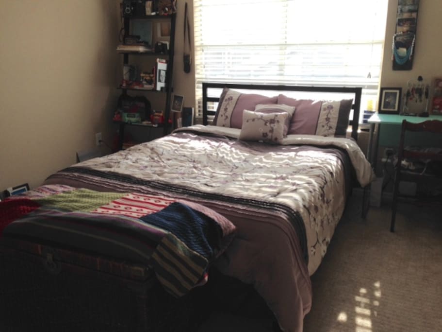 My Queen Size Bed with a desk, bookshelf and use of a closet.