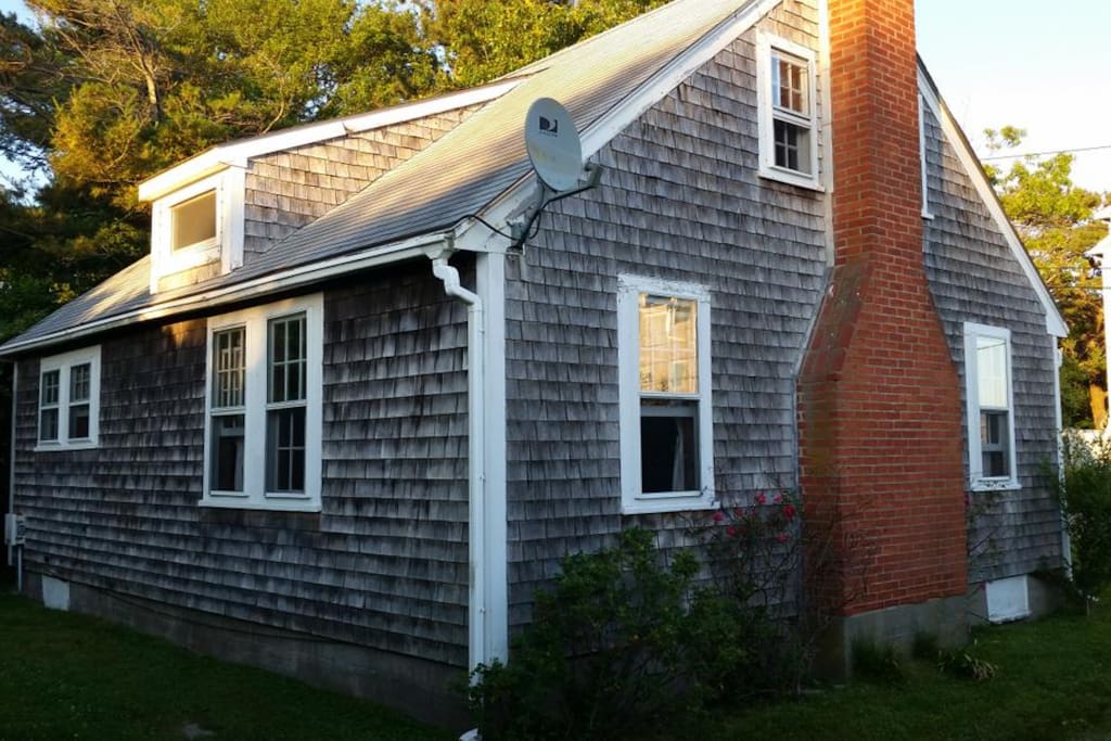 This beach cottage has tons of charm and a cute backyard.