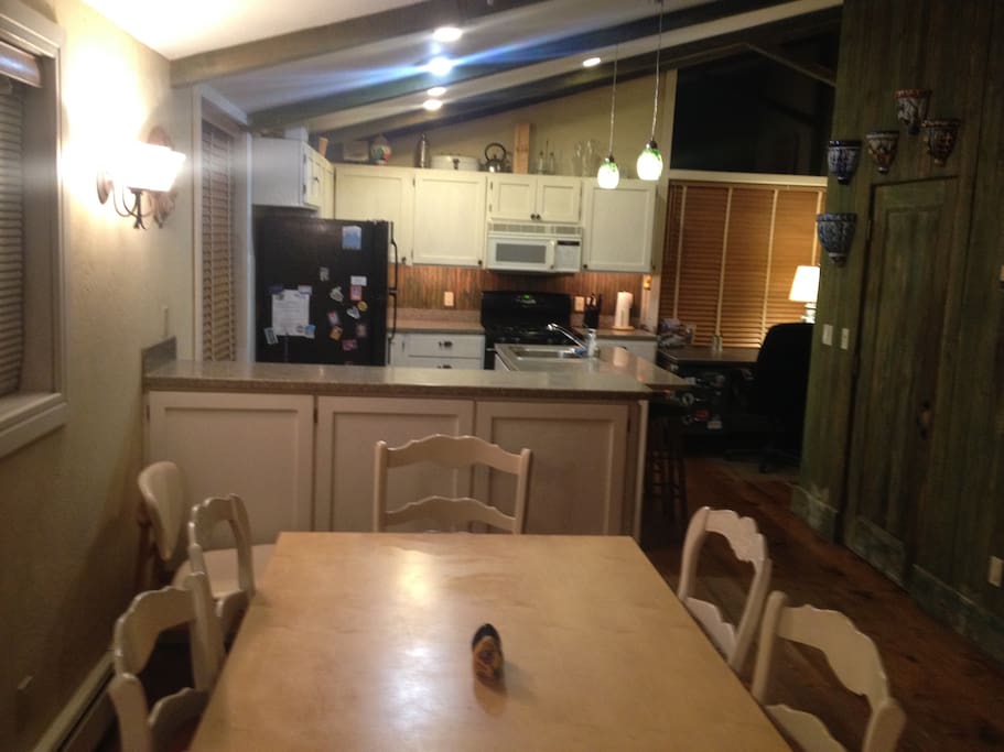 Dining room and kitchen with islands