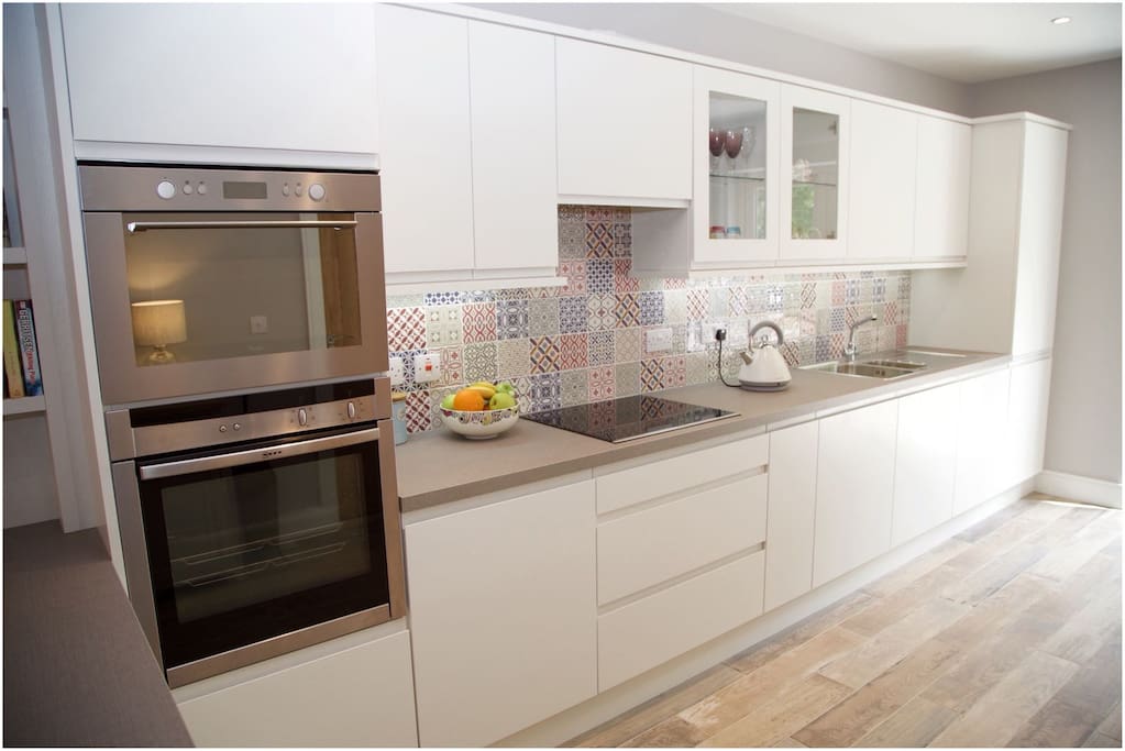 Prepare and cook your meals with ease in this stylish modern kitchen.