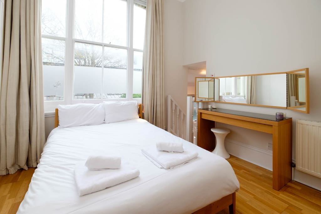 Bedroom 1 has a large double bed and an ensuite bathroom