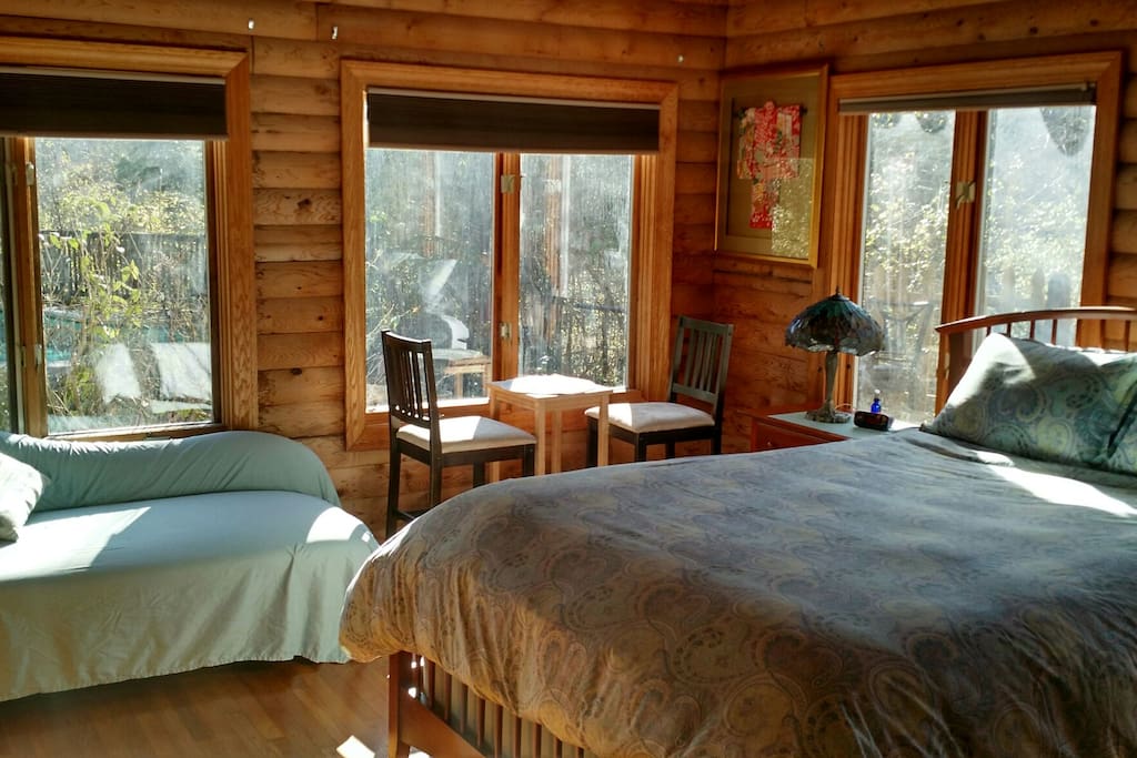 master bedroom overlooking the swimming pool in woods