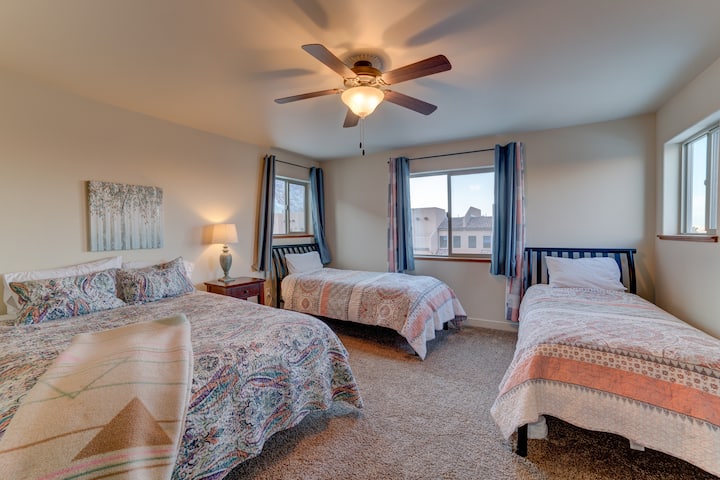 Front upstairs Master bedroom. One Queen and two Twin beds. Lots of light and views.
