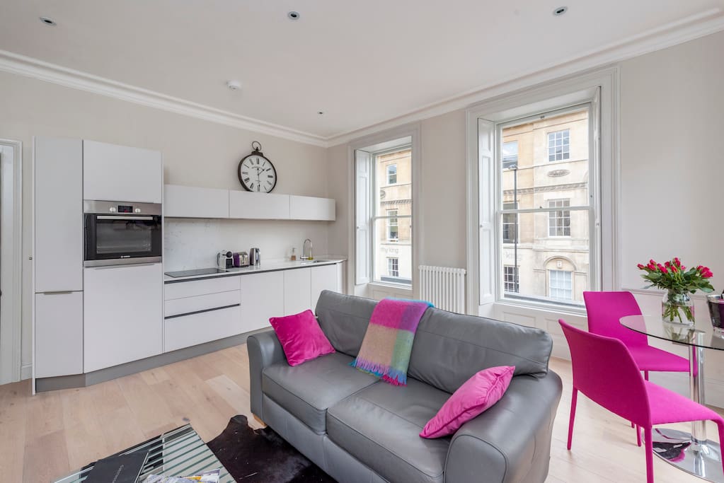 Open plan kitchen and living area with huge Georgian windows overlooking both Queen Square and Wood Street