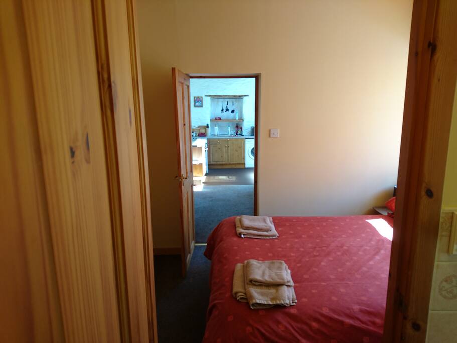 Bedroom looking to Lounge/Kitchen