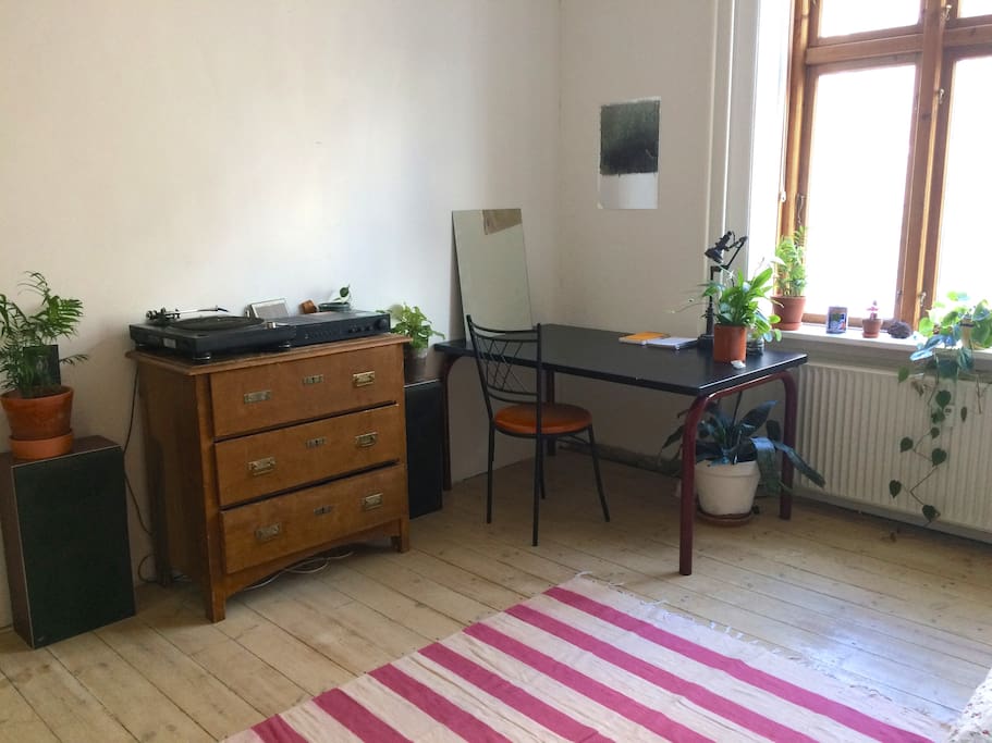 A practical table and sweet plants in the room