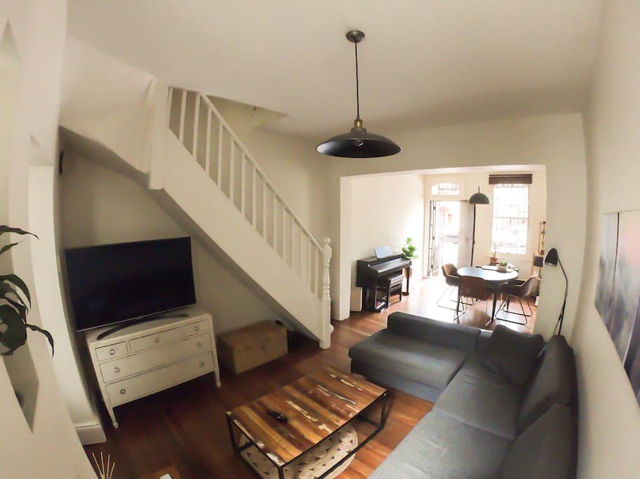 Living room (including 4K TV with Netflix!) and dining room.
