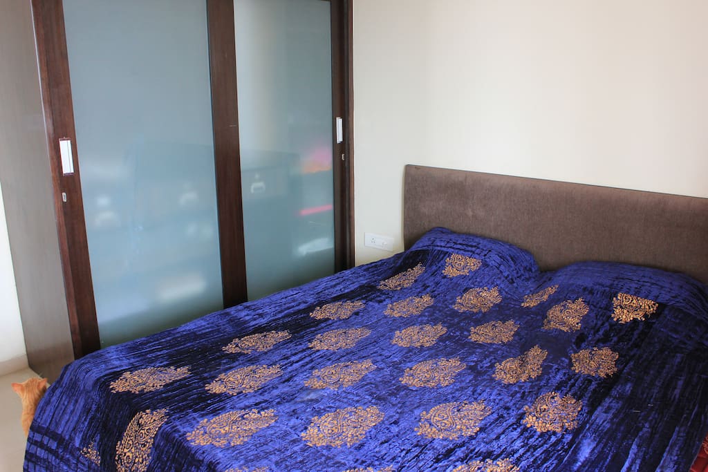 private room with kind size bed, big cabinet and direct access to terrace