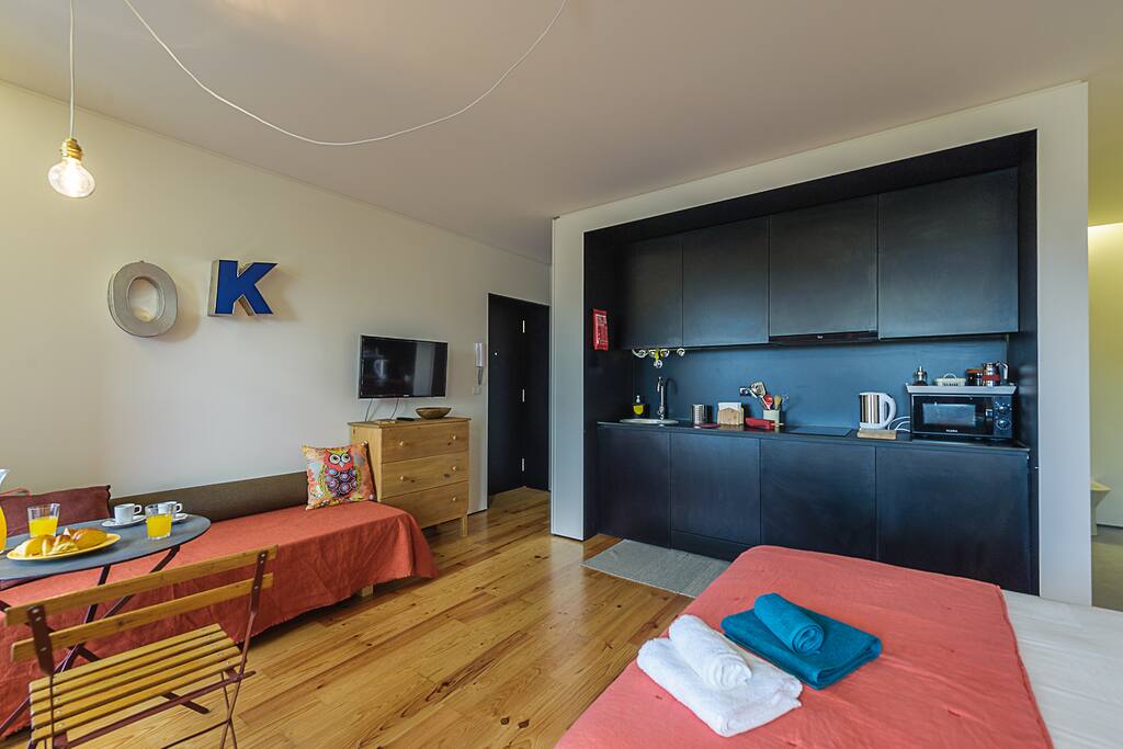 There is a small table and the sofa is a 75x180 bed as well.