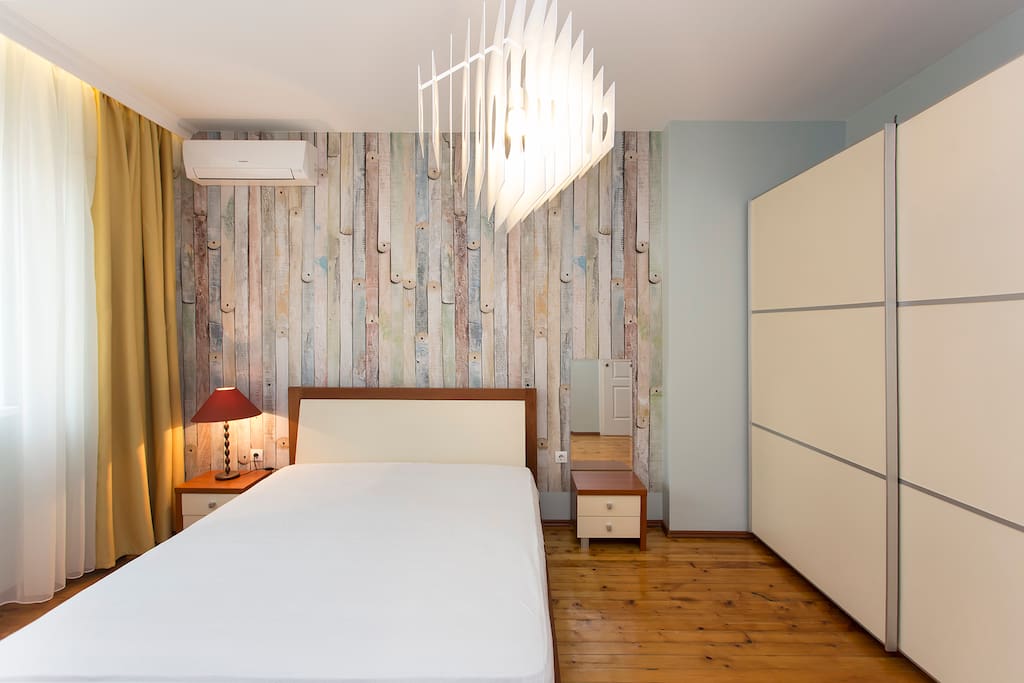 Bedroom with a double bed and plenty of storage space